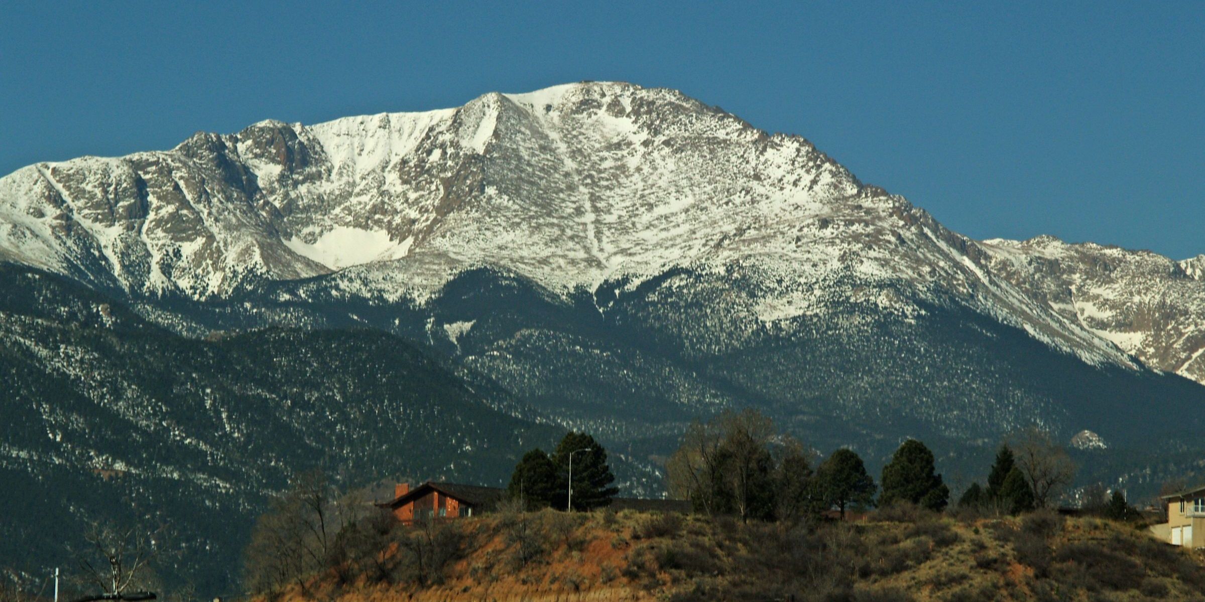 Pikes Peak rising above Colorado Springs neighborhoods